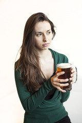 Beautiful Young Woman Holding Mug of Beer