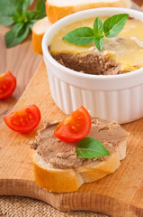 Homemade chicken liver pate, basil, tomatoes and slices bread