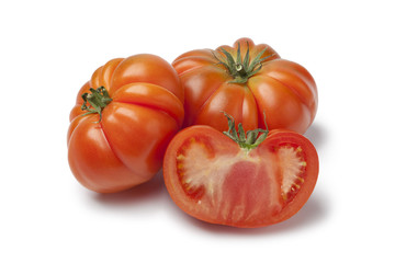 Organic whole and half Coeur de Boeuf tomatoes