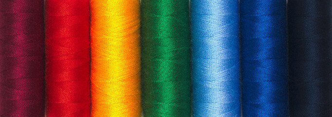 Rainbow colors thread spools background