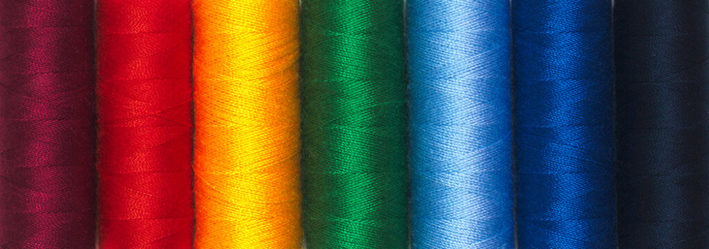 Rainbow colors thread spools background