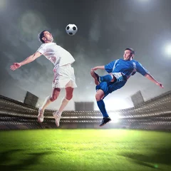 Washable wall murals Football two football players striking the ball