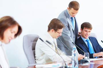 Obraz premium Four businesspeople at meeting