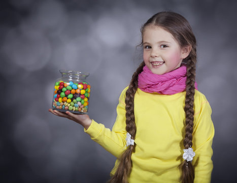 Little girl with jelly bean.