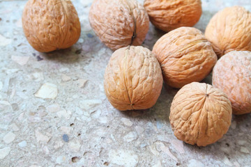 Walnuts on stony background