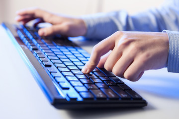 Click! Hands of a man on keyboard