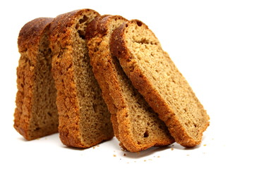 The cut loaf of bread isolated on white