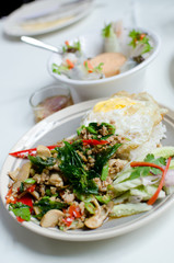Rice with fried pork and basil leaves