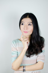 Naklejka premium Asian woman thinking