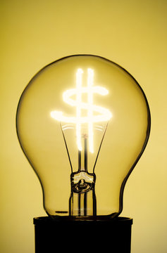 Light bulb with glowing Dollar Symbol