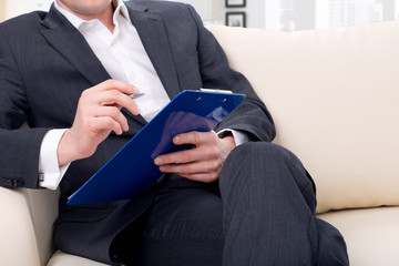 male psychologist  being ready to take notes