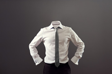 anonymous man in white shirt and black trousers