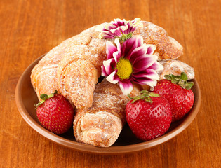 Fresh bagels with strawberry in the plate