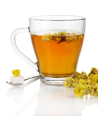 A cup of tea with immortelle isolated on white