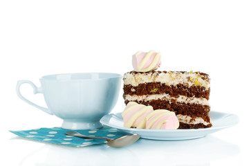 A cup of tea and delicious cake isolated on white