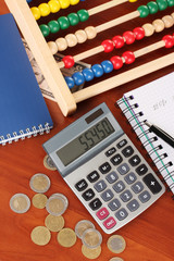 Bright wooden abacus and calculator. Conceptual photo of old