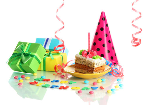 Colorful birthday cake with candle and gifts isolated on white