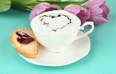 Composition of coffee, toast and tulips on color background