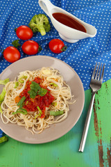 Tasty spaghetti with sauce and vegetables