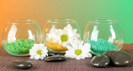 Sea salt in different colors in glass containers
