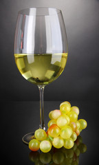 White wine glass on grey background