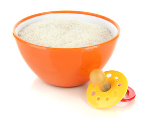 Powdered milk in bowl for baby and nipple isolated on white