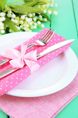 Table setting in white and pink tones