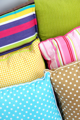 Many various pillows close-up