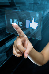 a woman finger select and like  on a english digital screen