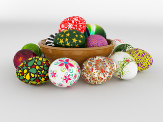 Easter eggs in a clay bowl on a white background