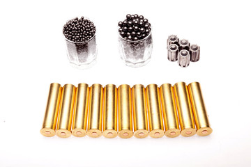 shot and hunting cartridges on a white background