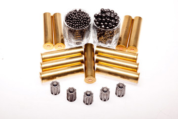 shot and hunting cartridges on a white background