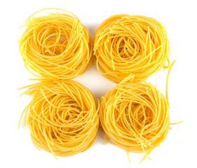 Italian egg pasta nest isolated on white background