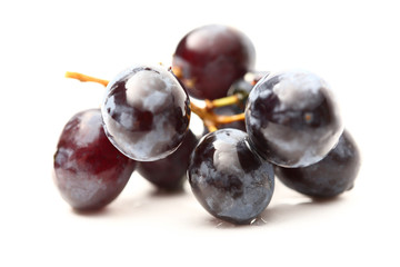 Black grapes isolated on the white background