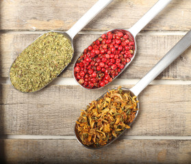 Condiments on wooden background