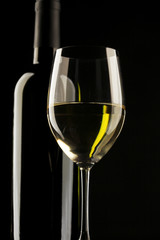 white wine glass silhouette black background