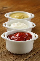 mustard, ketchup and mayonnaise - three kinds of sauces