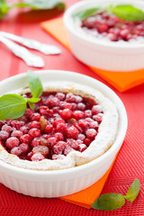 red currant mini cake in white baking dish