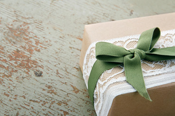 Decorative gift box wrapped in brown eco paper