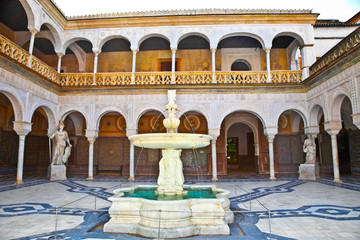 Courtyard of La Casa De Pilatos, Seville In Spain.