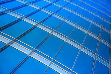 modern blue glass wall of skyscraper
