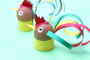 Colorful roosters made with eggs and paper