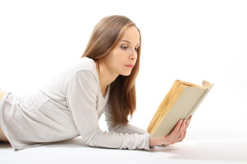 Lying girl with a book