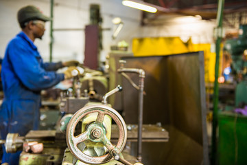 An industrial service repairmen labouring in workshop