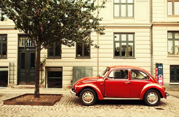 Fotobehang The red car in Copenhagen. © Oleg Podzorov