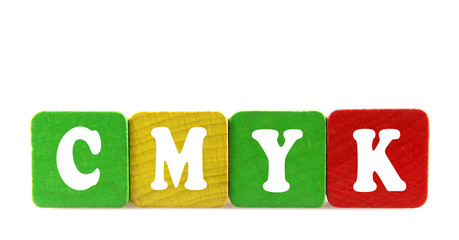 cmyk - isolated text in wooden building blocks