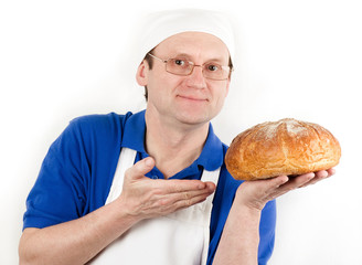 Male cook in uniform and hat with bread