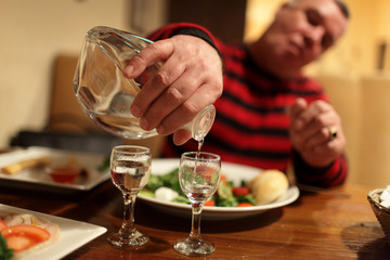 Man with decanter of vodka