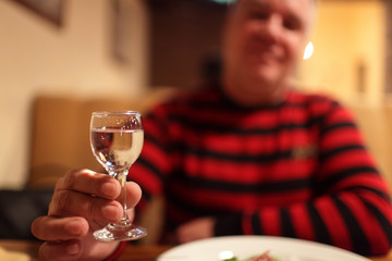 Man with vodka in pub