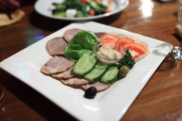 Slices of meat with vegetables